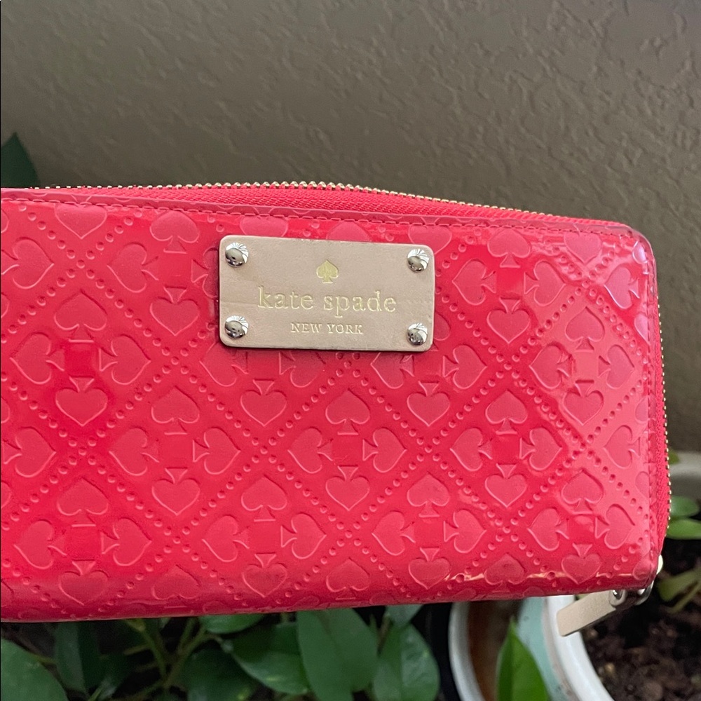 kate spade patent zip wallet in bright pink with embossed hearts